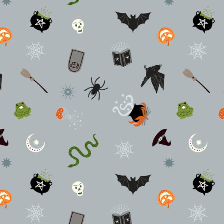 Lewis & Irene Cast a Spell fabric with a grey background and Halloween images like bats, snakes, cauldrons on it.