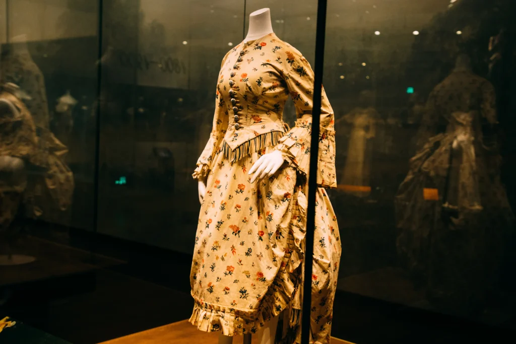 Floral vintage dress in a glass display case